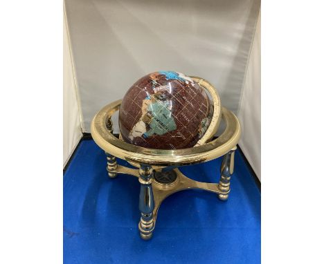 A SEMI PRECIOUS STONE GLOBE ON A BRASS STAND WITH COMPASS 