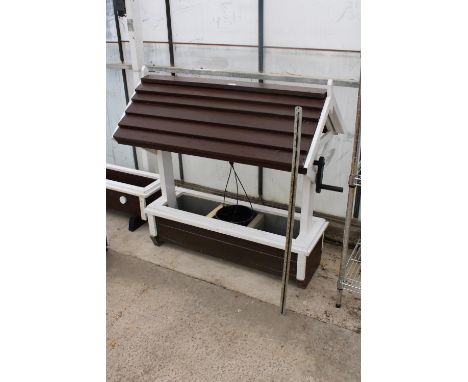 A WOODEN WISHING WELL TROUGH PLANTER 