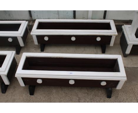 A PAIR OF LARGE WOODEN PAINTED TROUGH PLANTERS 