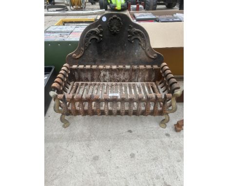 A VINTAGE CAST IRON FIRE GRATE 