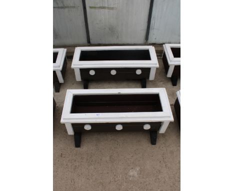 A PAIR OF SMALL WOODEN TROUGH PLANTERS 