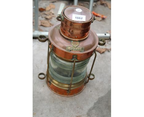 A VINTAGE COPPER SHIPS LANTERN WITH A BRASS ANCHOR LABEL 