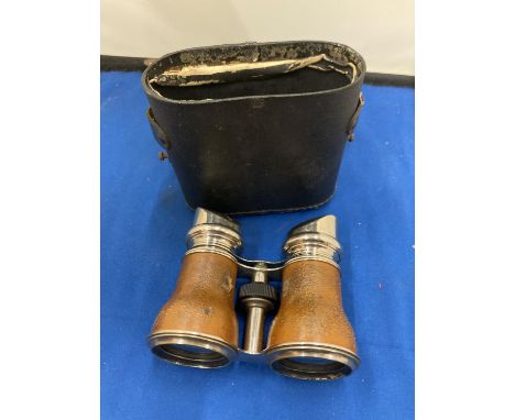 A PAIR OF VINTAGE FRENCH LEATHER WRAPPED PARIS JOCKEY CLUB BINOCULARS WITH CASE 