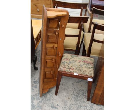 A SMALL OAK STOOL AND A WALL MOUNTED SHELF WITH COAT HOOKS 