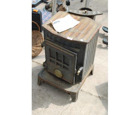 A VINTAGE CAST IRON FLAVEL LOG BURNER 