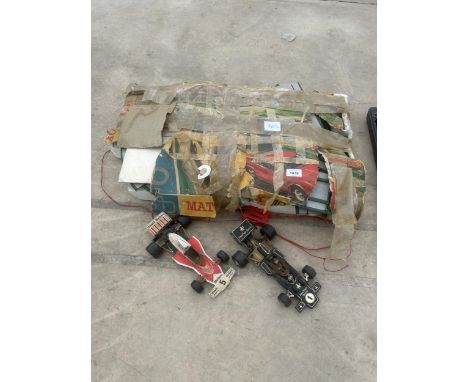 A VINTAGE RACE TRACK SET AND TWO RACE CARS 