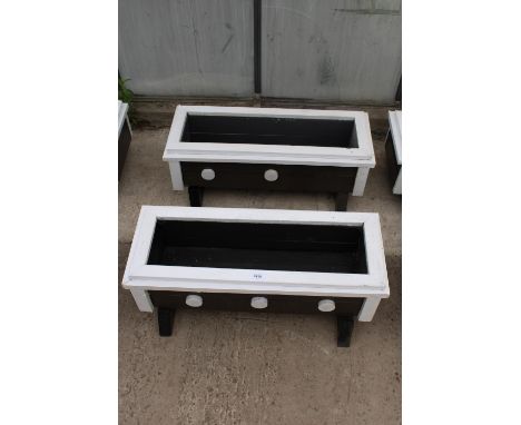 A PAIR OF SMALL WOODEN TROUGH PLANTERS 