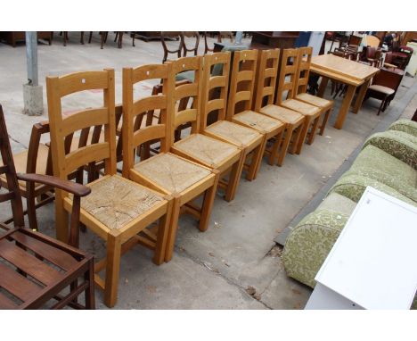 AN OAK DRAW-LEAF DINING TABLE ON SQUARE LEGS, 66" X 36" (2 LEAVES 18" EACH) AND EIGHT LADDER-BACK DINING CHAIRS WITH RUSH SEA