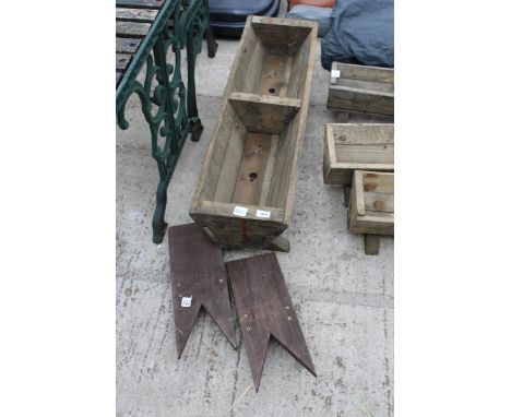 A WOODEN TROUGH PLANTER AND TWO BOOT REMOVERS 