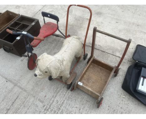 A VINTAGE CHILDS TRICYCLE, PUSH ALONG DOG AND TROLLEY ETC 