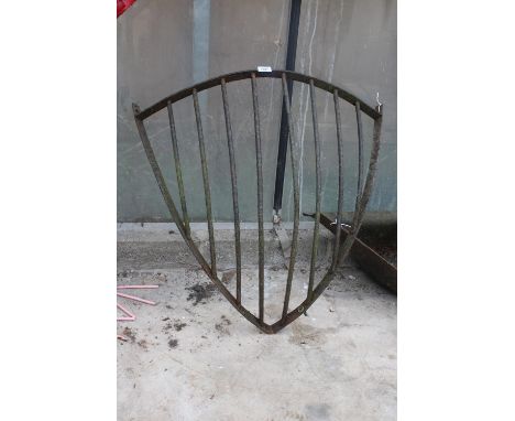 A VINTAGE CAST IRON CORNER HAYRACK PLANTER 