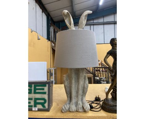 A LARGE TABLE LAMP DEPICTING A HARE WITH EARS COMING OUT FROM A GREY SHADE 