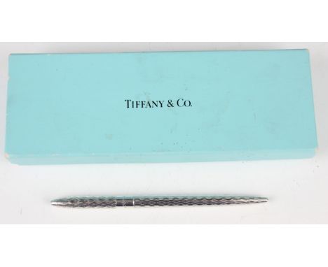 A Tiffany &amp; Co sterling silver ballpoint pen with engine turned decoration, with original Tiffany &amp; Co box.Buyer’s Pr