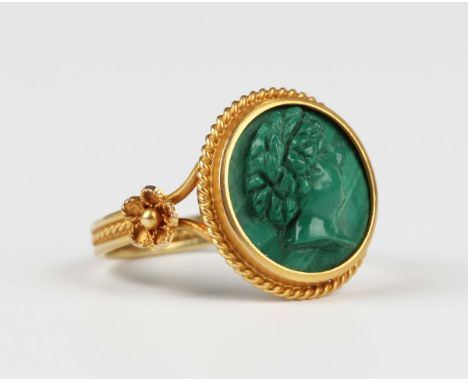 A gold and malachite cameo ring, carved as a classical portrait within a wirework surround with floral motifs to the shoulder