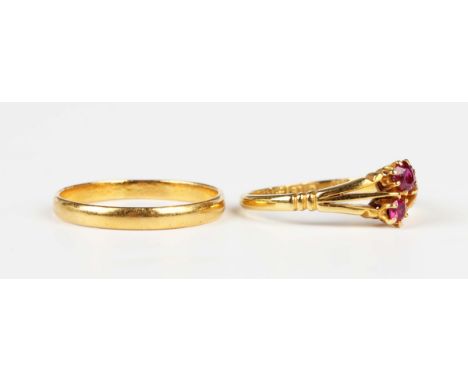 A gold wedding ring, marks rubbed, weight 1.6g, ring size approx M, and an 18ct gold, ruby and red gem set ring with split sh