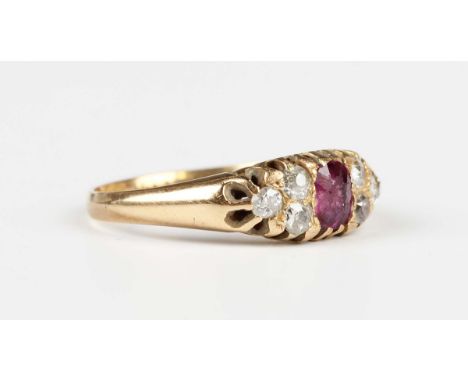 A late Victorian 18ct gold, ruby and diamond ring, mounted with the oval cut ruby between diamond three stone sides, Birmingh