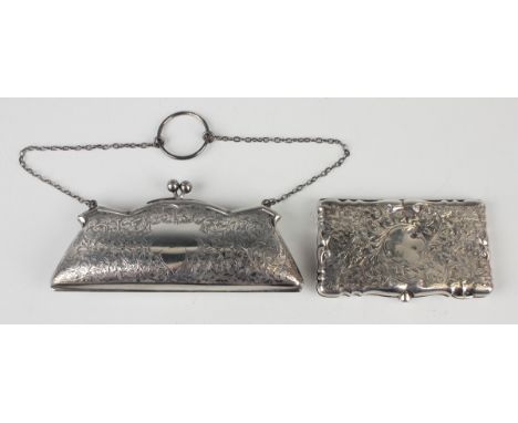 A George V silver lady's purse with foliate scroll engraved decoration, hinged to reveal a leather interior, Birmingham 1920 