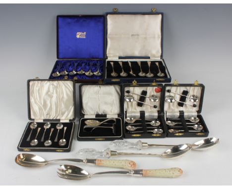 A pair of Edwardian silver salad servers with cut glass handles, Chester 1903 by Haseler Brothers, length 29.2, together with
