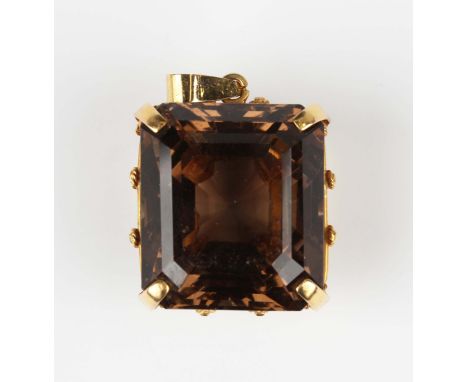 A gold pendant, claw set with a large cut cornered rectangular step cut smoky quartz, unmarked, weight 21.5g, length 3.7cm.Bu