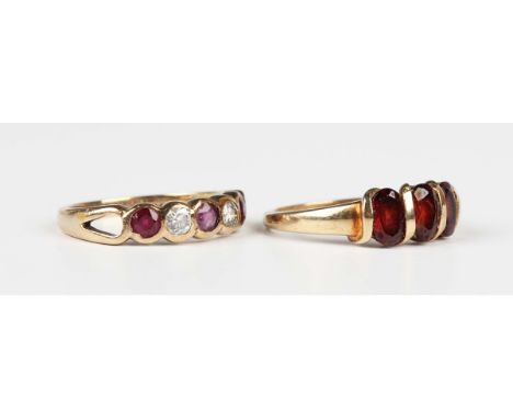 A 9ct gold, ruby and diamond five stone ring, London 1990, ring size approx L, and a 9ct gold and garnet three stone ring, mo