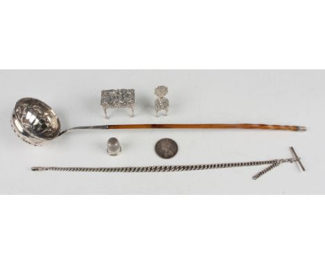 A George III silver punch ladle with twisted porcupine quill handle, length 37.5cm, together with a silver graduated curblink