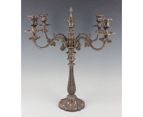 An early 19th century plated four-branch five-light candelabrum, each foliate scroll branch with urn shaped sconce, nozzle an
