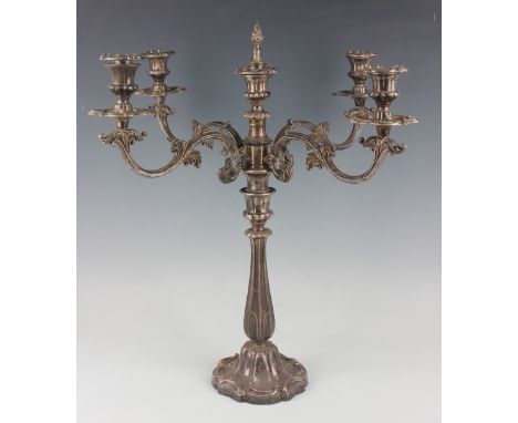 An early 19th century plated four-branch five-light candelabrum, each foliate scroll branch with urn shaped sconce, nozzle an