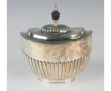 A late Victorian silver oval tea caddy with half-reeded decoration, London 1893 by Edward Hutton, weight 188g, height 12cm.Bu