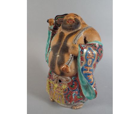 A Polychrome Glazed Ceramic Oriental Study of a Laughing Bare Chested Gent. 22cm High 