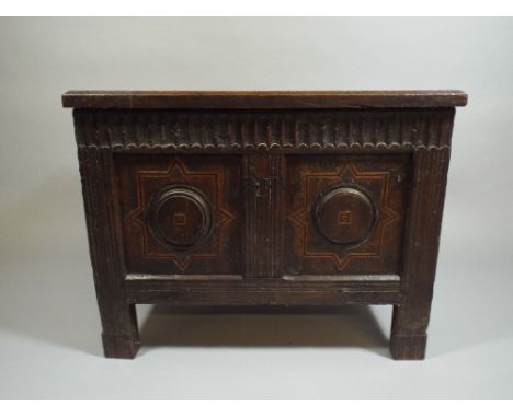 An Early and Small Two Panel Oak Coffer with Inlaid Front Panels. Carved Top Rail. 72x46x57cm
