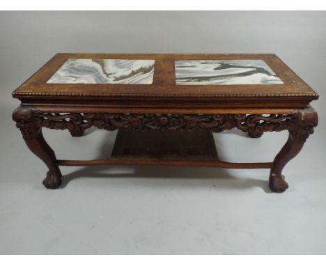 A 20th Century Oriental Carved Coffee Table with Two Inset Marble Panels on Cabriole Supports with Claw and Ball Feet. Stretc