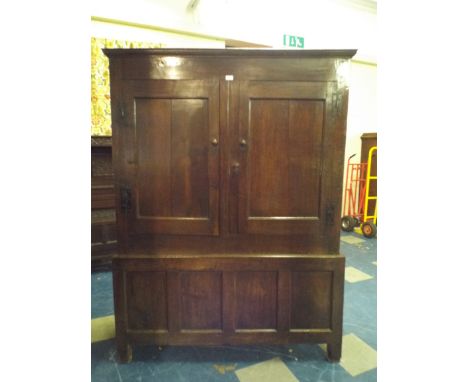 An Early Oak Livery Cupboard with Panelled Doors Having Iron H Hinges. Four Panel Base. 