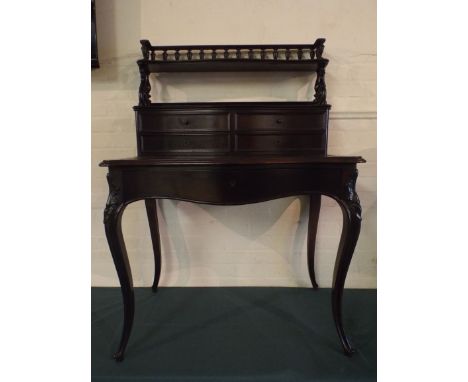 An Art Nouveau Mahogany Bonheur Du Jour with Serpentine Front and Single Long Drawer. Raised Back with Four Serpentine Drawer