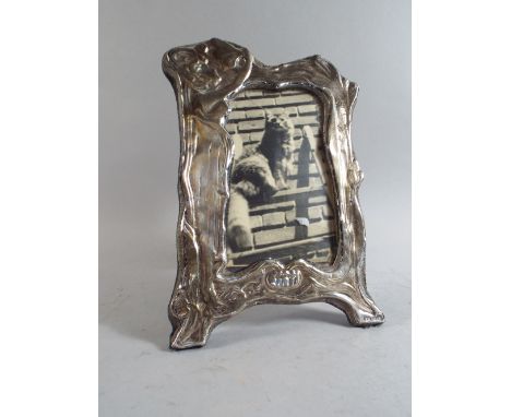 A Silver Easel Photo Frame in the Art Nouveau Style with Standing Maiden in Relief. 22cm HIgh
