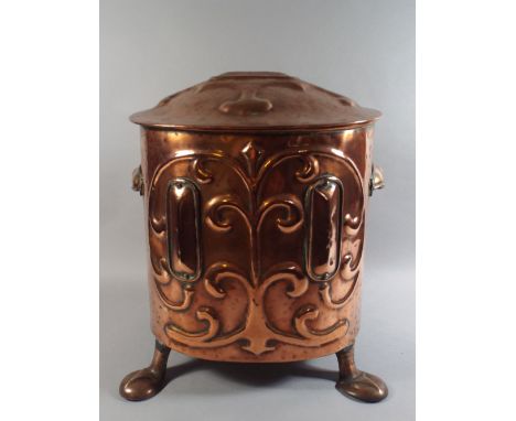An Art Nouveau Copper Coal Bucket with Relief Decoration and Complete with Original Liner. 37cm High