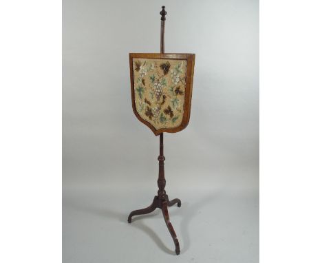 A 19th Century Mahogany Pole Screen with a Decorative Beadwork Panel. 140cm High