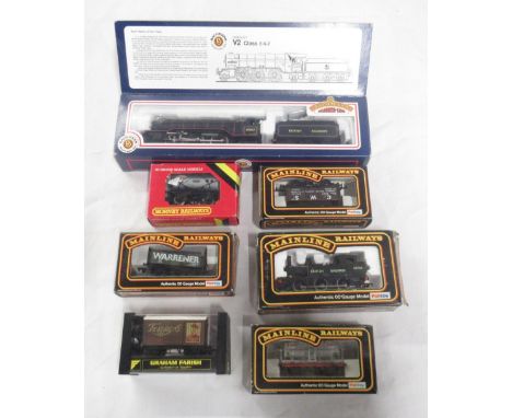 Seven OO gauge wagons including Bachmann V2 class 2-6-2 locomotive with tender, J72 class tank with British livery, ESSO tank