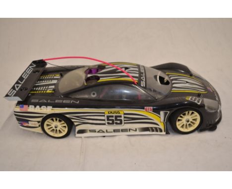 A 1/10 scale Mugen Seiki MTX-3 nitro powered radio control car (with instruction manual) with an HPI Saleen S7R bodyshell and