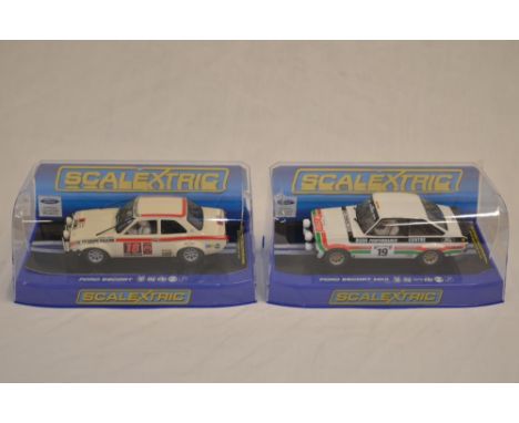 2 Scalextric slot cars by Hornby (1/32 scale):Ford Escort Mk1, London-Mexico (model no C3313), car in as new condition.Ford E