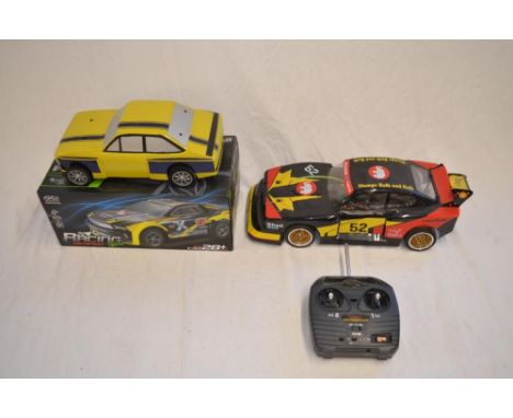 2 electric powered radio control cars, one 4WD with added Carson Motorsport Mampe bodyshell (damaged spoiler) with Acoms Tech