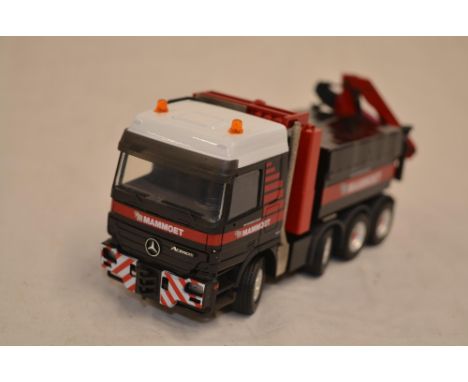 Boxed 1/50 scale diecast Mammoet Actros SLT 4 axle with crane model by Conrad (model no 40002/02). Model in near mint conditi