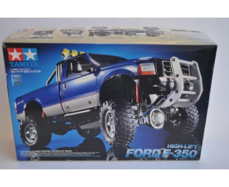 Unbuilt boxed Tamiya 1/10th scale Ford F-350 High Lift radio control 4x4 Pick-up truck, item no 58372-450006. Stock kit, requ