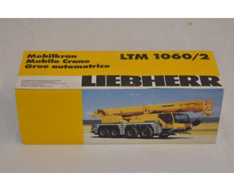 Boxed 1/50 scale diecast Liebherr LTM 1060/2 mobile telescopic crane model by Conrad (model no 2094) painted in red Feuerwehr