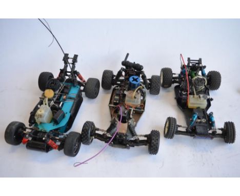 3 1/10 scale nitro radio control off road car chassis, 1 SMT (4WD), 1 Traxxus (2WD), 1 FP'S Pizazz-BG1 (2WD) with box. All A/