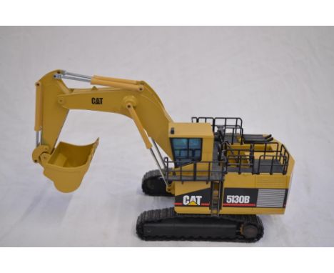 Boxed 1/50 scale diecast Caterpillar 5130B Mass Excavator model by NZG (model no 391/1). Model is in good condition though th