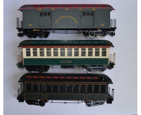 3 G gauge Bachmann twin bogie passenger coaches, no boxes. One has been re purposed as a Northeast coach with new side decal 