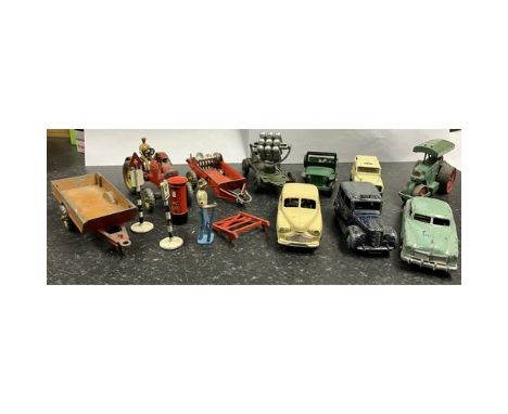 Collection of Dinky diecast vehicle models including farm trailer, tractor with driver, Austin taxi, Vanguard, etc