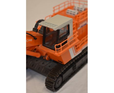 2 boxed diecast hydraulic excavator models: A 1/60 scale Hitachi EX1800 "Giant Excavator" with face shovel by Shinsei (model 