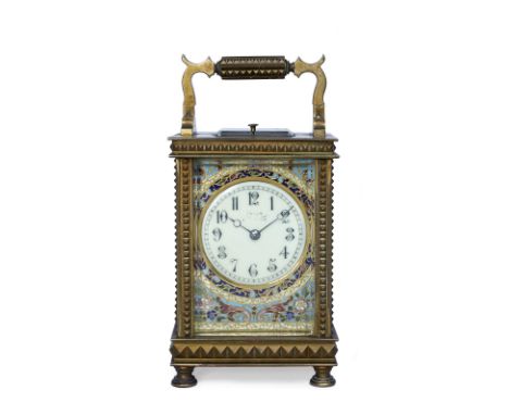 A French carriage clock the Gothic enamel dial with moon hands and polychrome floral champlevé mask, coiled gong strike and p