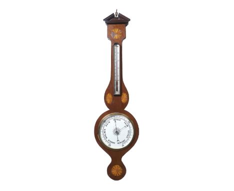 A Sheraton revival mahogany aneroid wheel barometer with spirit tube thermometer, the patera inlaid case with break arch pedi